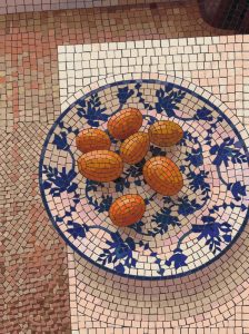 Mosaic Still Life: Orange Fruits on a Blue Plate